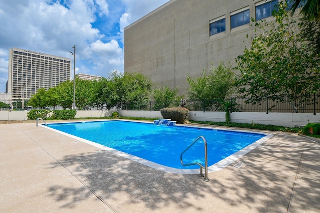 view of pool featuring a patio