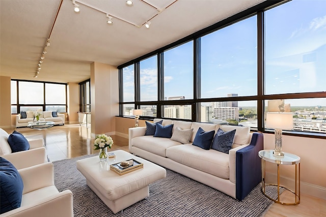 sunroom featuring plenty of natural light and track lighting