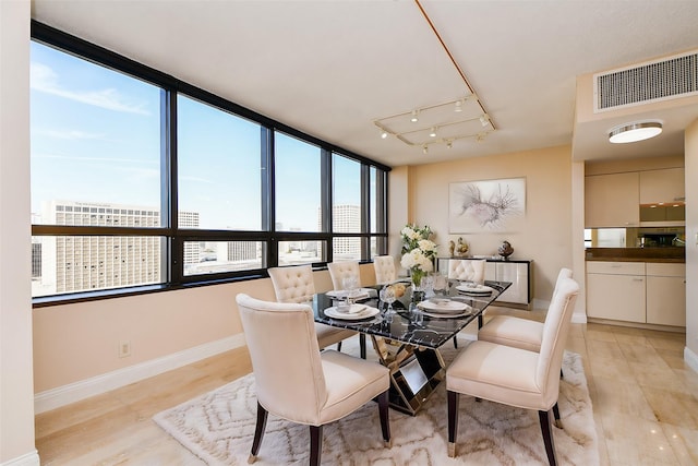 dining space featuring light hardwood / wood-style flooring