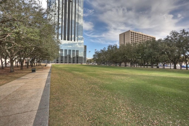 view of home's community featuring a lawn