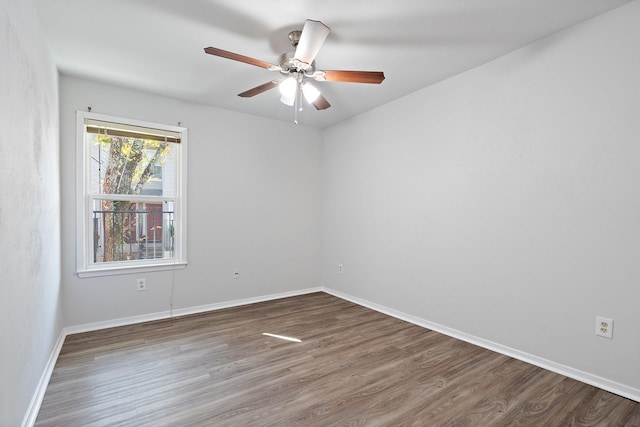 empty room featuring ceiling fan and wood-type flooring