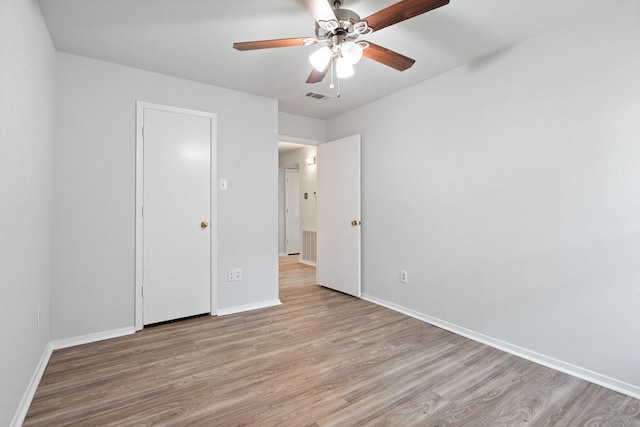 unfurnished bedroom featuring light hardwood / wood-style floors and ceiling fan