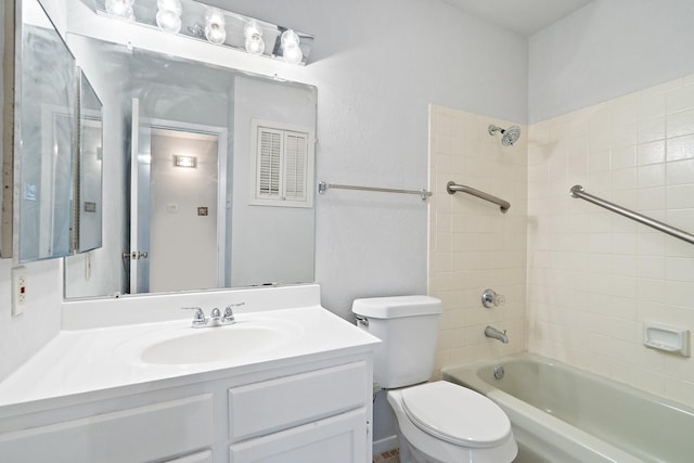 full bathroom featuring vanity, toilet, and tiled shower / bath combo