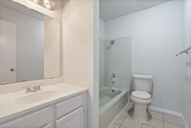 full bathroom featuring tile patterned floors, vanity, tiled shower / bath combo, and toilet