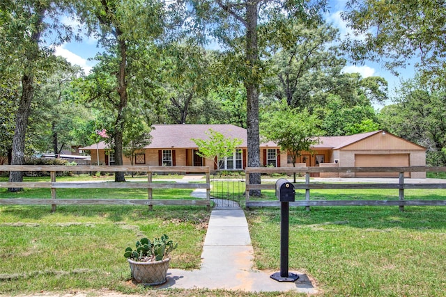 ranch-style home with a garage and a front lawn