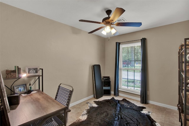 home office with light tile patterned flooring and ceiling fan