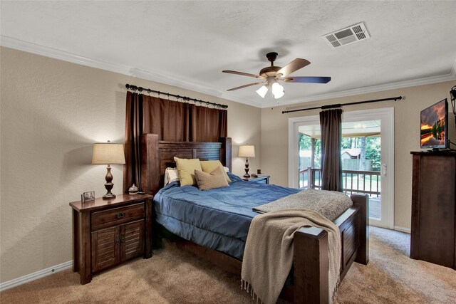 bedroom featuring ceiling fan, crown molding, a textured ceiling, access to outside, and light carpet