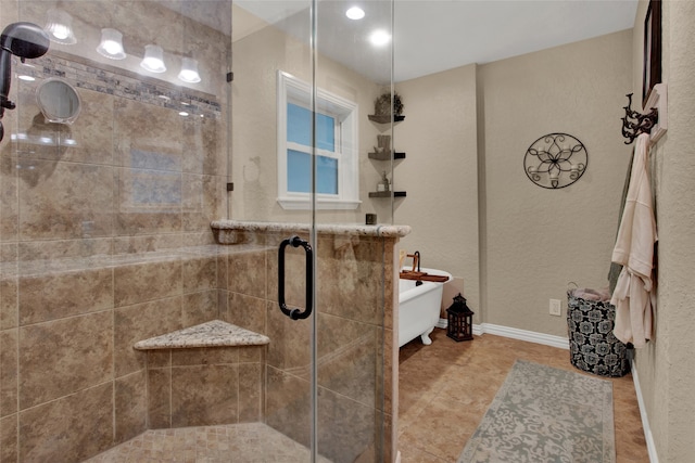 bathroom with shower with separate bathtub and tile patterned flooring