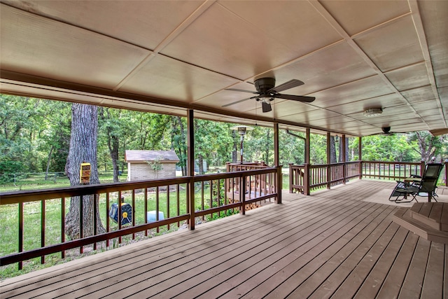 wooden terrace featuring ceiling fan