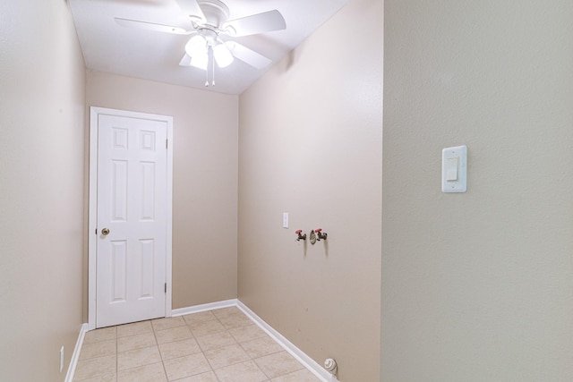 washroom with ceiling fan and light tile patterned floors