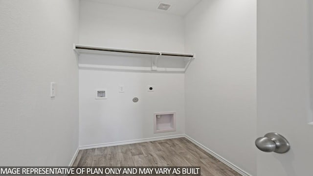 laundry room featuring hookup for an electric dryer, washer hookup, light hardwood / wood-style flooring, and hookup for a gas dryer