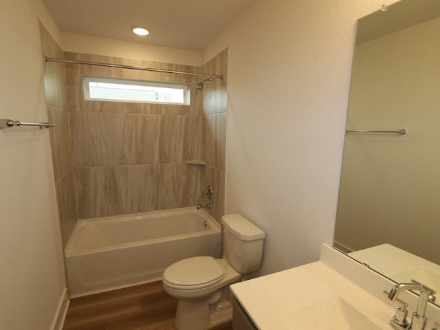 223 River Grove St, Willis, TX 77378 - full bath featuring wood finished floors, shower / bathtub combination, toilet, and vanity