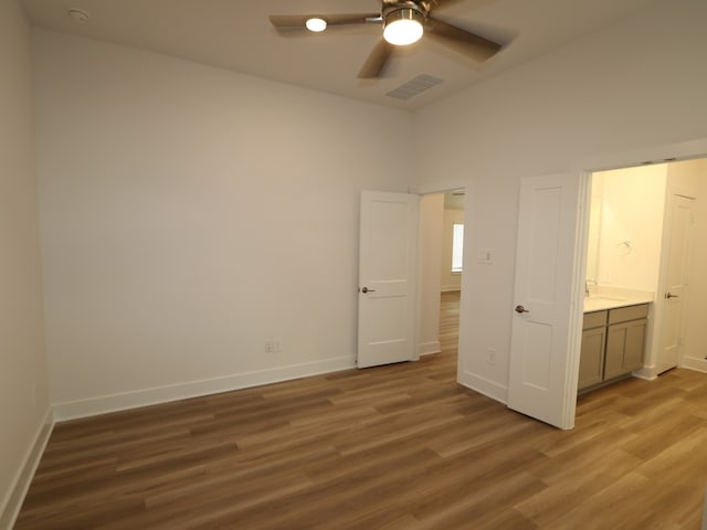 223 River Grove St, Willis, TX 77378 - unfurnished bedroom featuring a ceiling fan, baseboards, visible vents, and wood finished floors