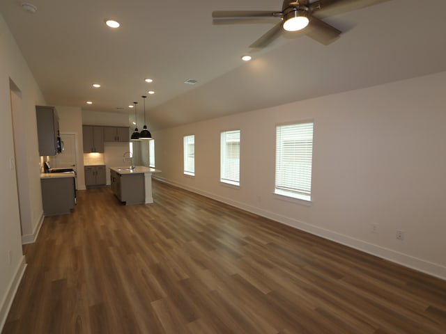 223 River Grove St, Willis, TX 77378 - unfurnished living room featuring baseboards, ceiling fan, recessed lighting, a sink, and dark wood finished floors