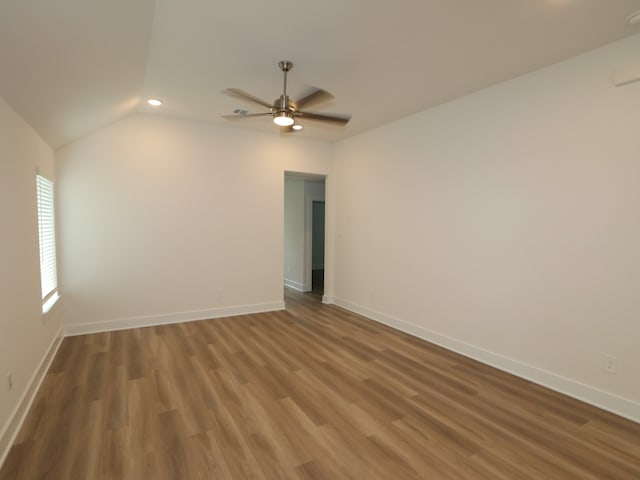 223 River Grove St, Willis, TX 77378 - spare room featuring ceiling fan, vaulted ceiling, wood finished floors, baseboards, and recessed lighting