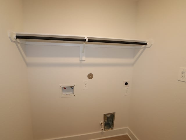 223 River Grove St, Willis, TX 77378 - laundry room featuring gas dryer hookup, hookup for an electric dryer, laundry area, baseboards, and hookup for a washing machine