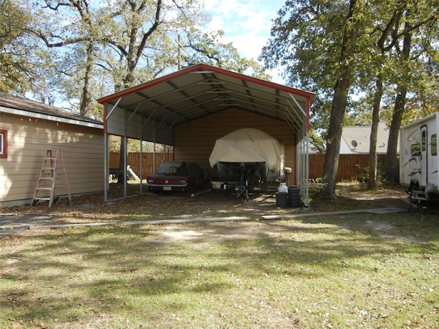 view of car parking featuring a carport and a yard