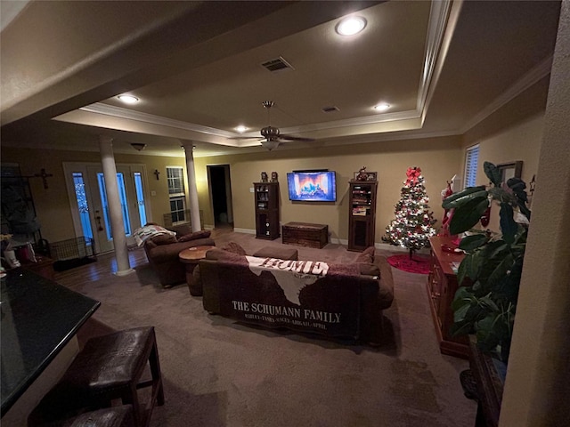 living room featuring a raised ceiling, carpet floors, and crown molding