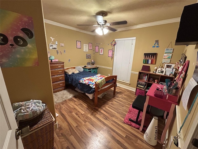 bedroom with hardwood / wood-style flooring, ceiling fan, and ornamental molding