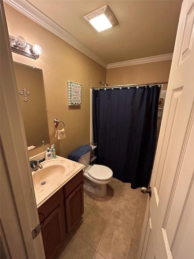 bathroom with vanity, tile patterned floors, crown molding, a shower with shower curtain, and toilet