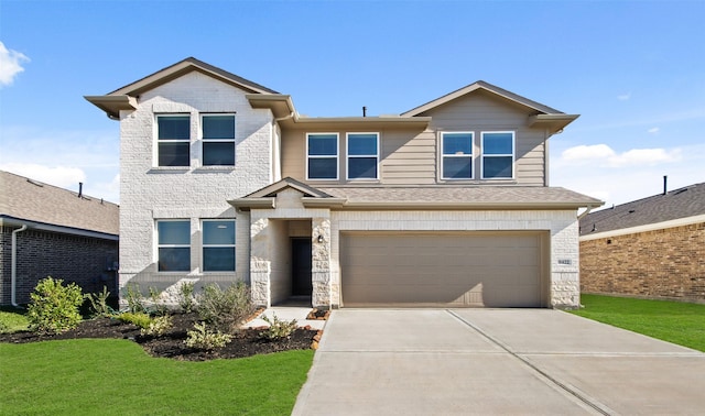 view of front facade with a front lawn and a garage