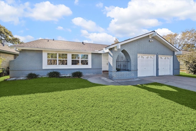 single story home featuring a garage and a front lawn