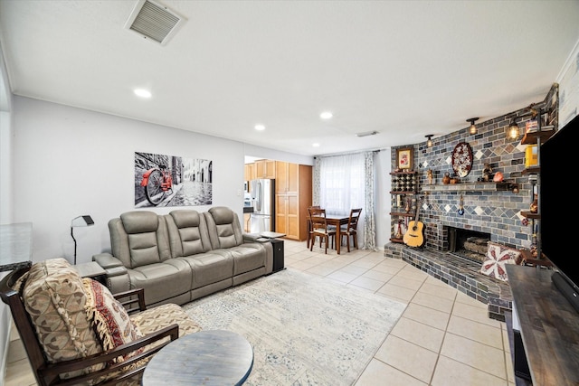 living room featuring light tile patterned flooring and a fireplace