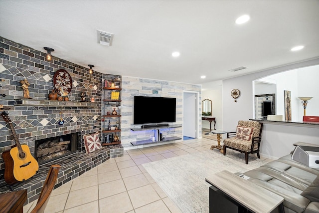 tiled living room with a fireplace