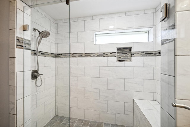 bathroom featuring tiled shower