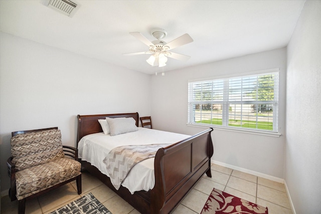 tiled bedroom featuring ceiling fan