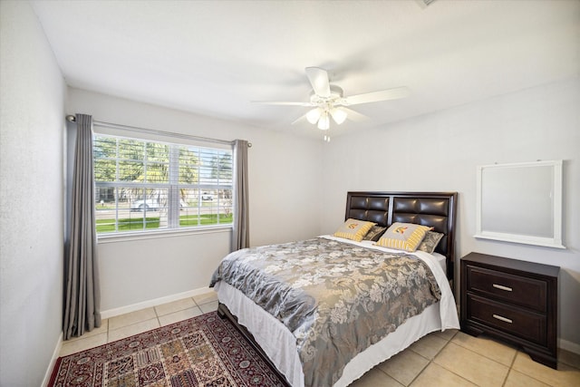 bedroom featuring ceiling fan and light tile patterned flooring