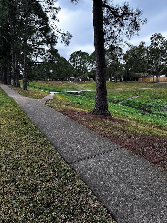 view of home's community featuring a lawn