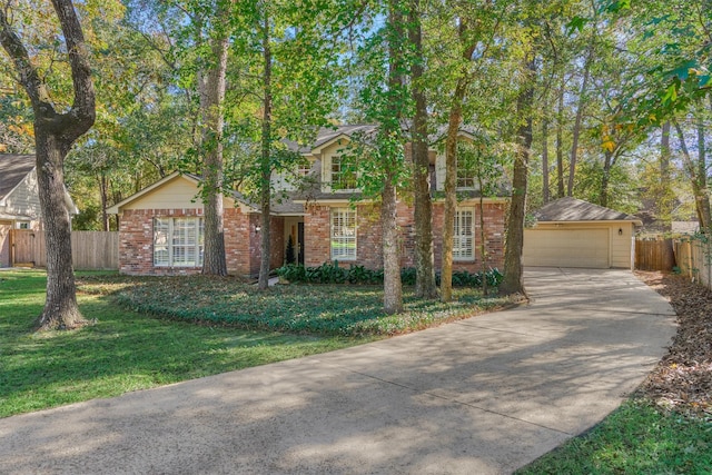 view of front facade featuring an outbuilding, a front lawn, and a garage