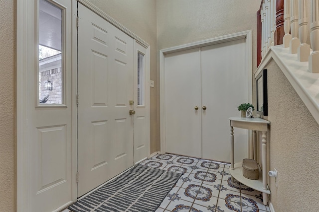 entryway featuring light tile patterned floors