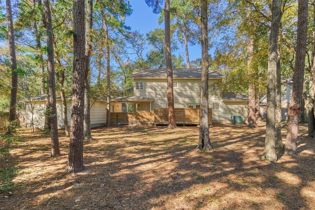 rear view of property with central AC unit