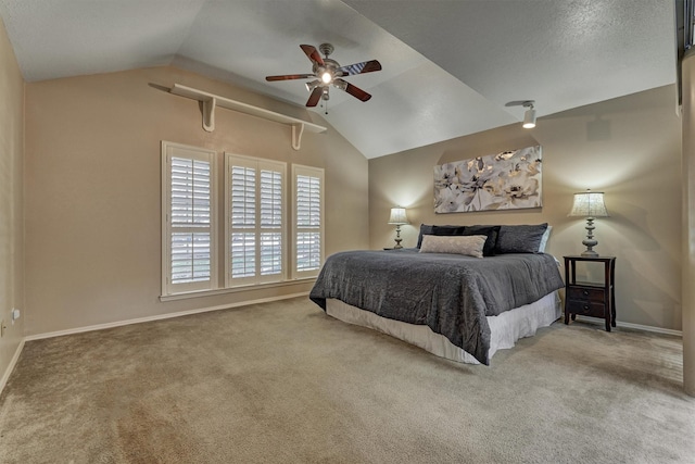 carpeted bedroom with ceiling fan and lofted ceiling