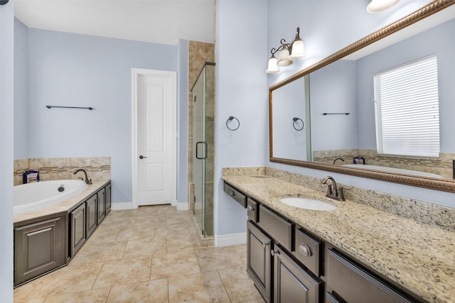 bathroom featuring plus walk in shower, vanity, and tile patterned floors