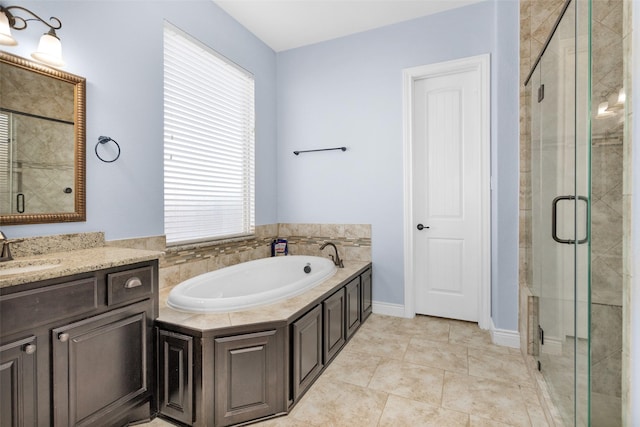 bathroom featuring tile patterned flooring, vanity, and separate shower and tub