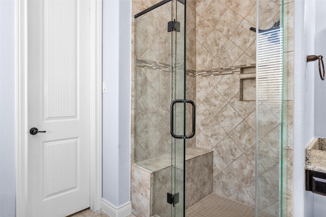 bathroom featuring an enclosed shower