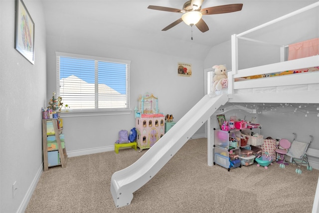 carpeted bedroom with ceiling fan and lofted ceiling