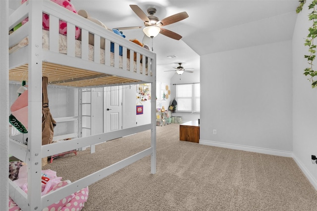 unfurnished bedroom featuring ceiling fan and carpet floors