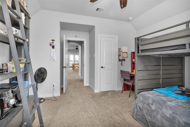 carpeted bedroom with ceiling fan and lofted ceiling