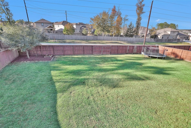 view of yard featuring a trampoline