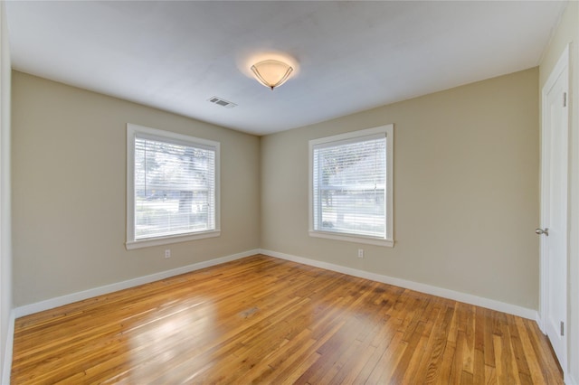 spare room with light wood-type flooring