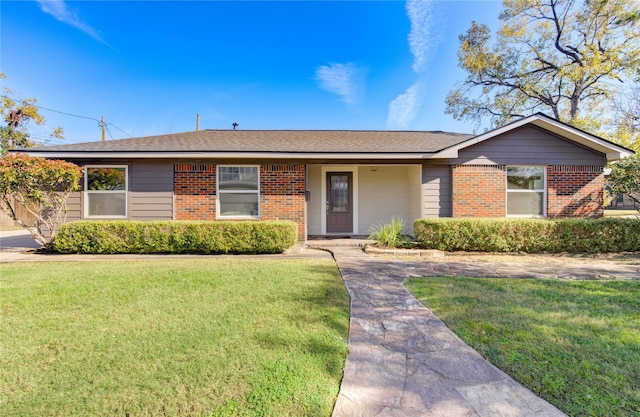 ranch-style home with a front lawn