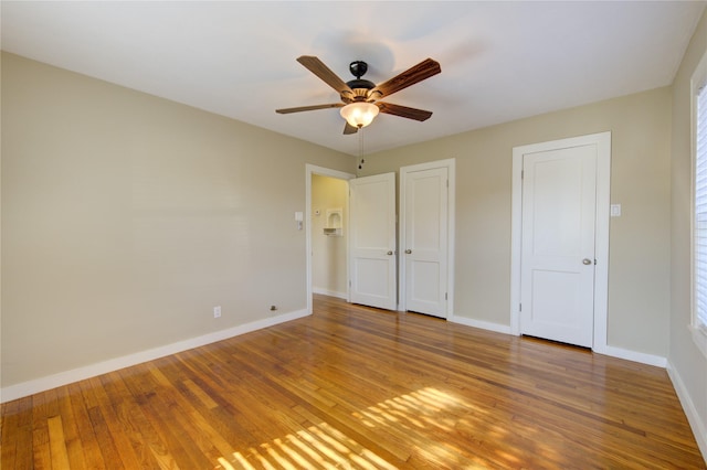 unfurnished bedroom with hardwood / wood-style flooring and ceiling fan