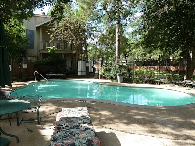 view of swimming pool with a patio