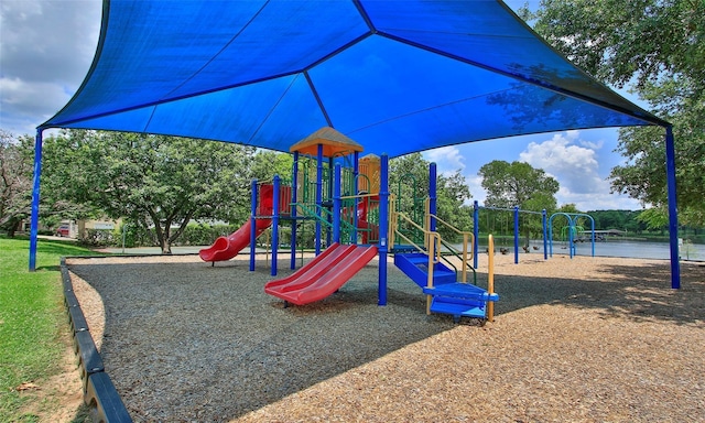 view of playground with a water view