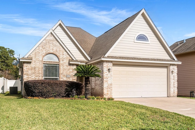 view of property with central AC, a front yard, and a garage