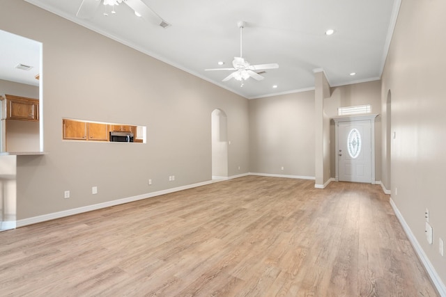 unfurnished living room with light hardwood / wood-style flooring, ceiling fan, and ornamental molding